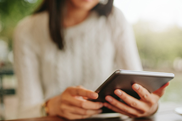  Young woman holding a tablet 360px